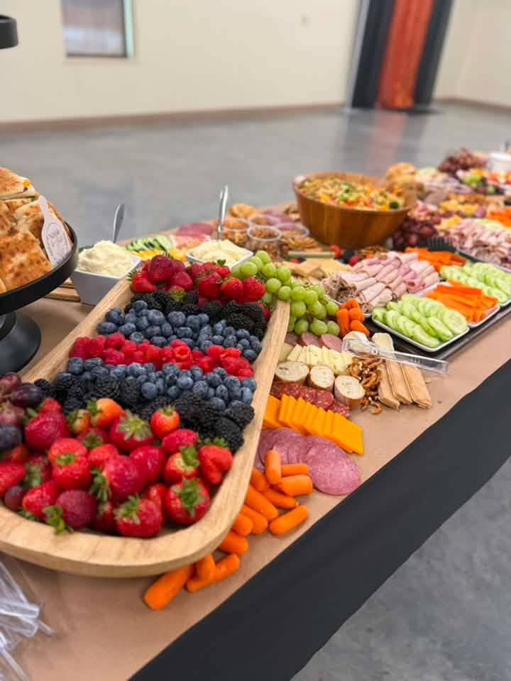 Large grazing table with fruits and charcuterie